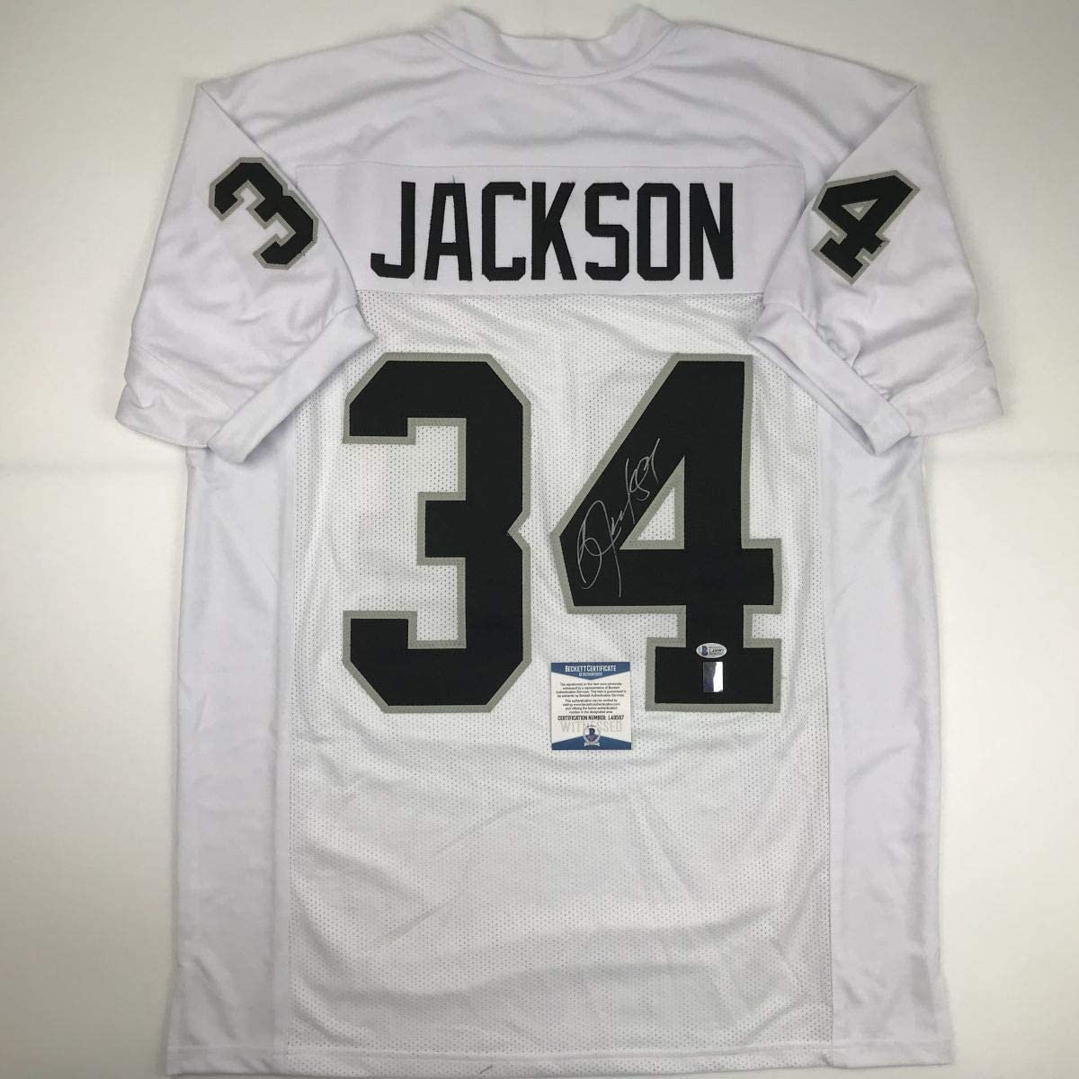 Autographed/Signed Bo Jackson Oakland White Football Jersey Beckett BAS COA