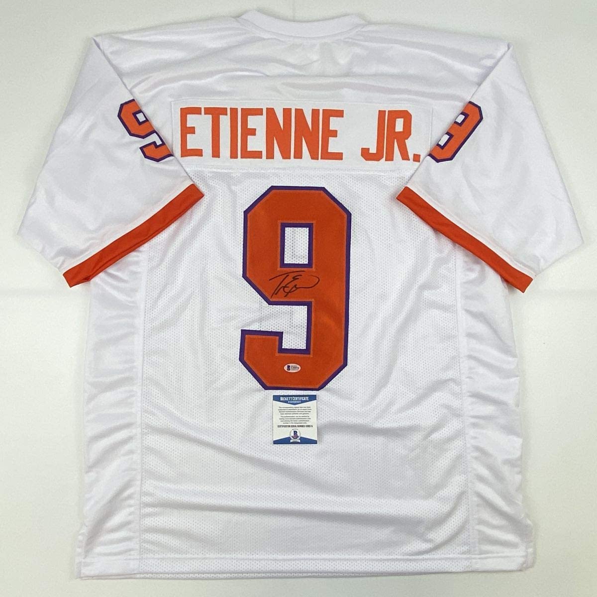 Autographed/Signed Travis Etienne Jr. Clemson White College Football Jersey Beckett BAS COA