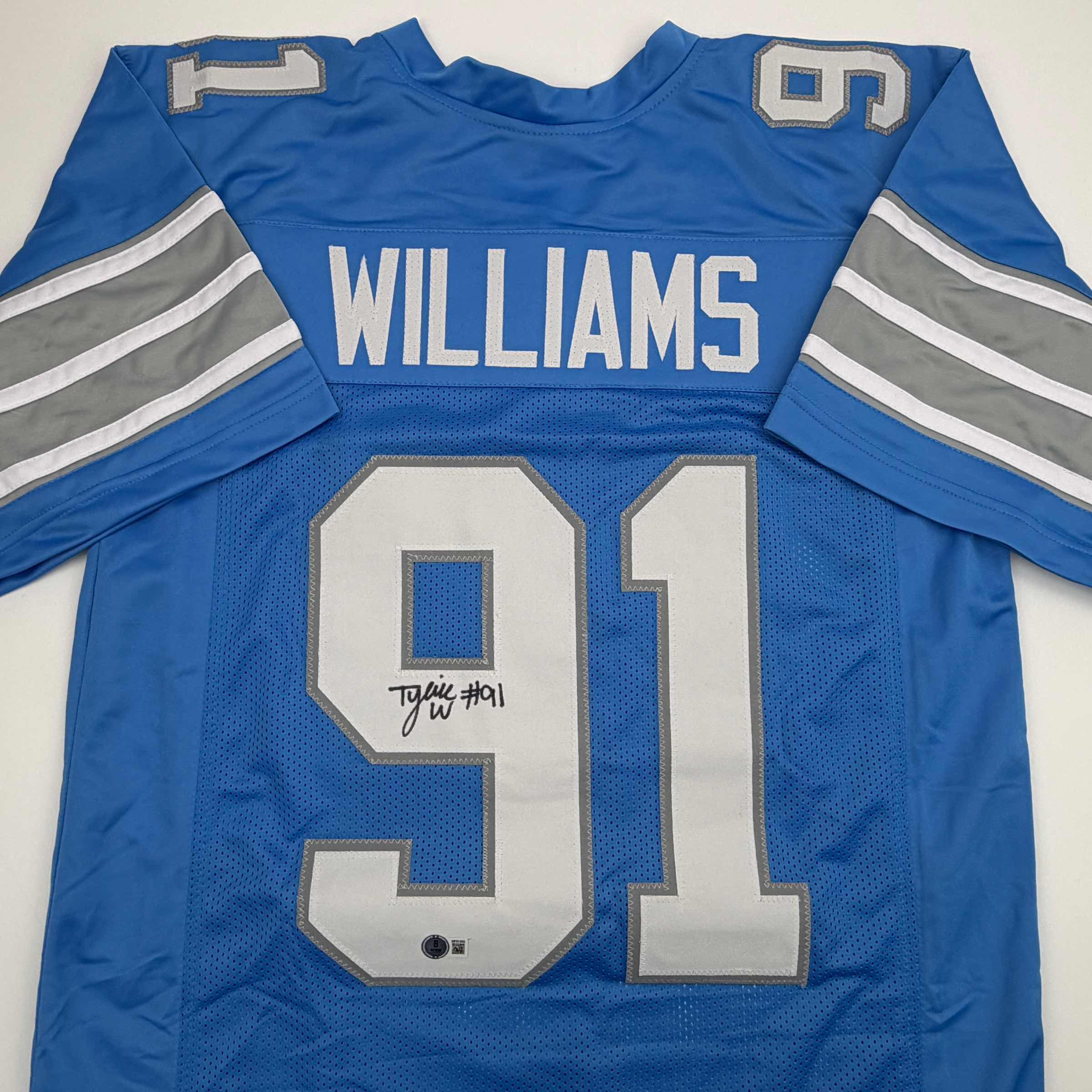 Autographed/Signed Tyleik Williams Detroit Blue Football Jersey Beckett BAS COA