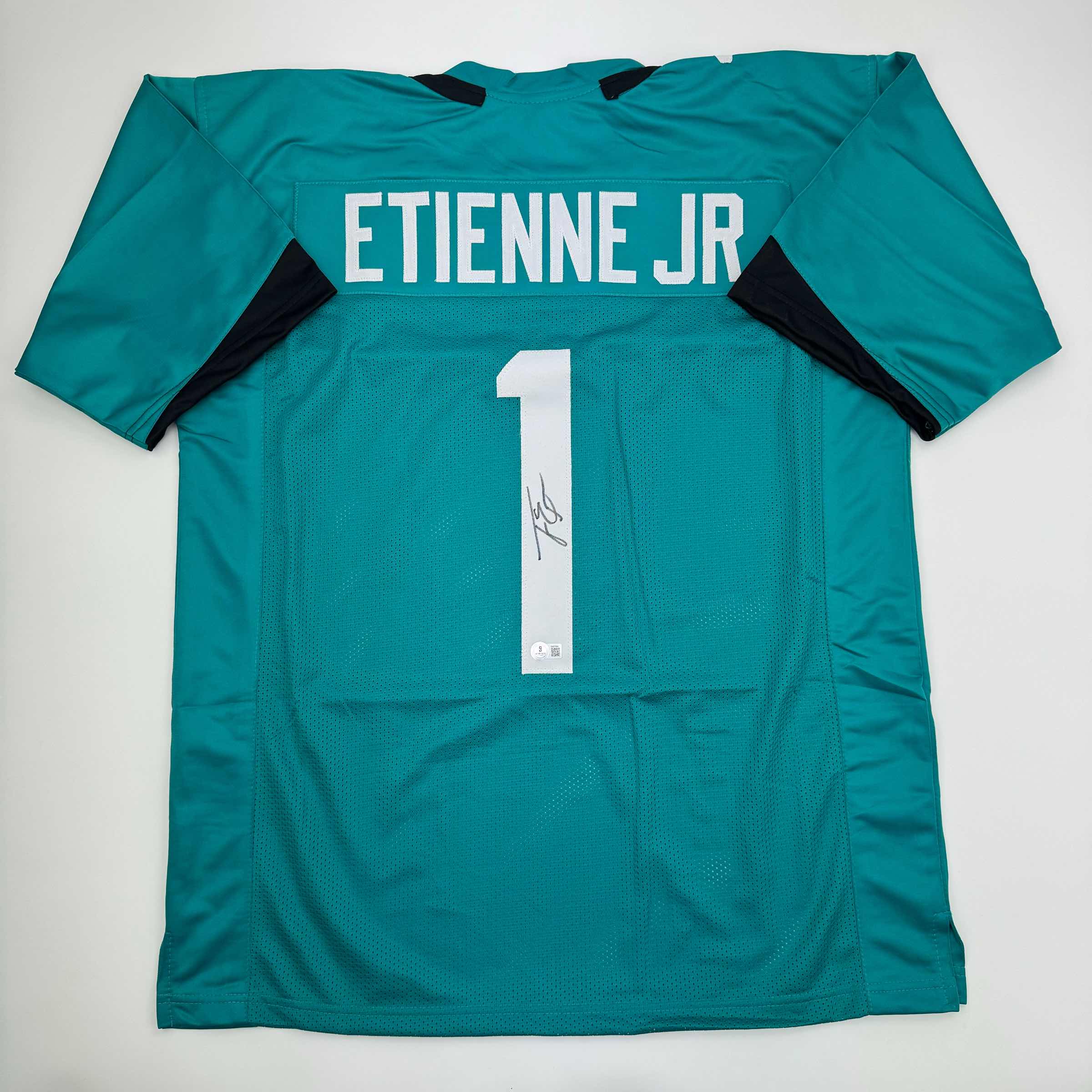 Autographed/Signed Travis Etienne Jr. Jacksonville Teal Football Jersey Beckett BAS COA
