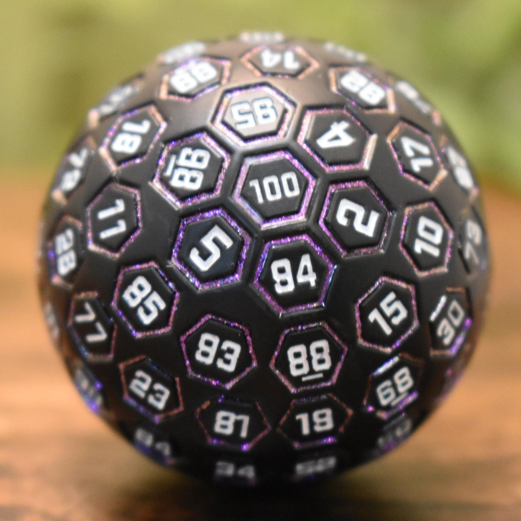 The Orb D100 - Purple, White, and Black Metal Die