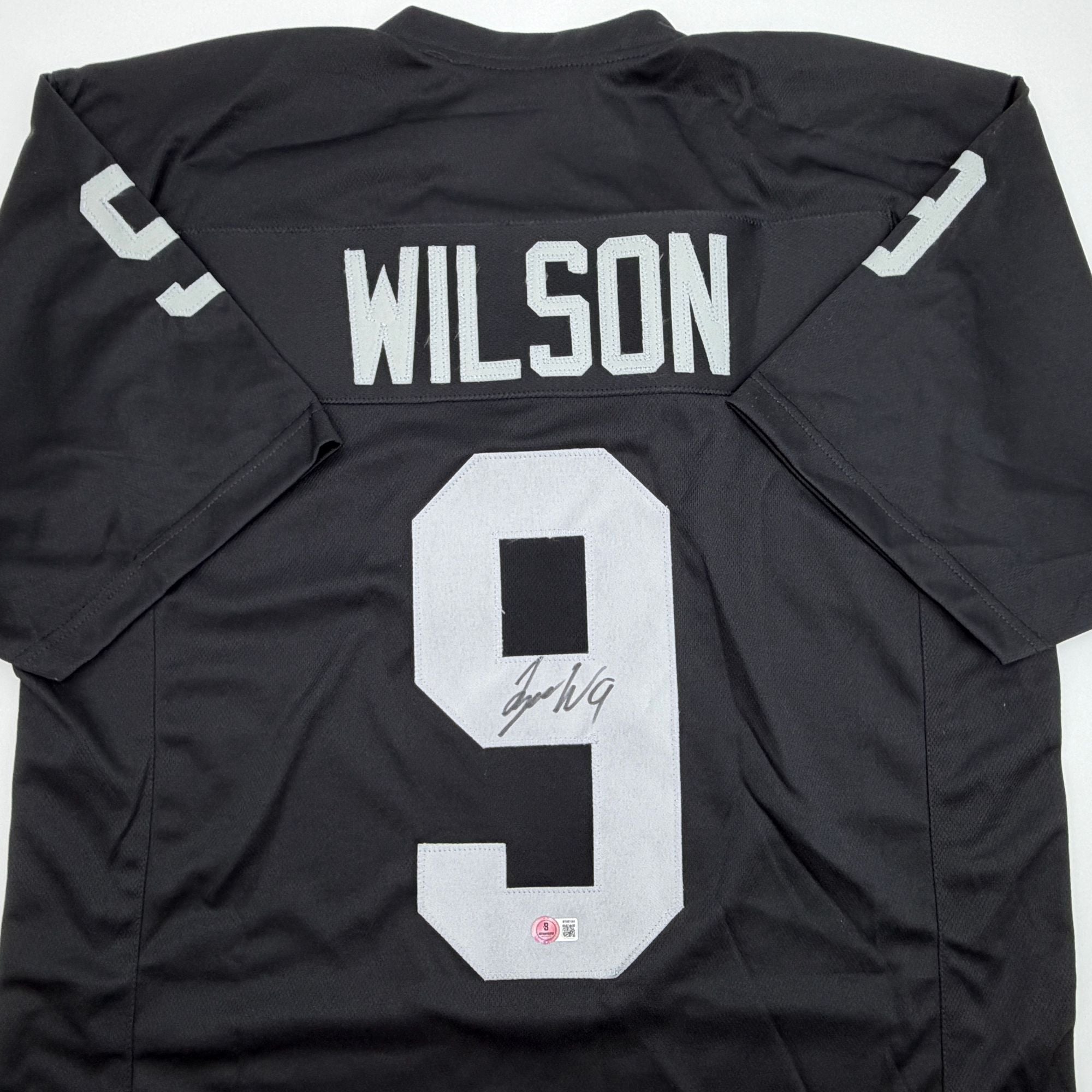 Autographed/Signed Tyree Wilson Oakland Las Vegas Black Football Jersey Beckett BAS COA