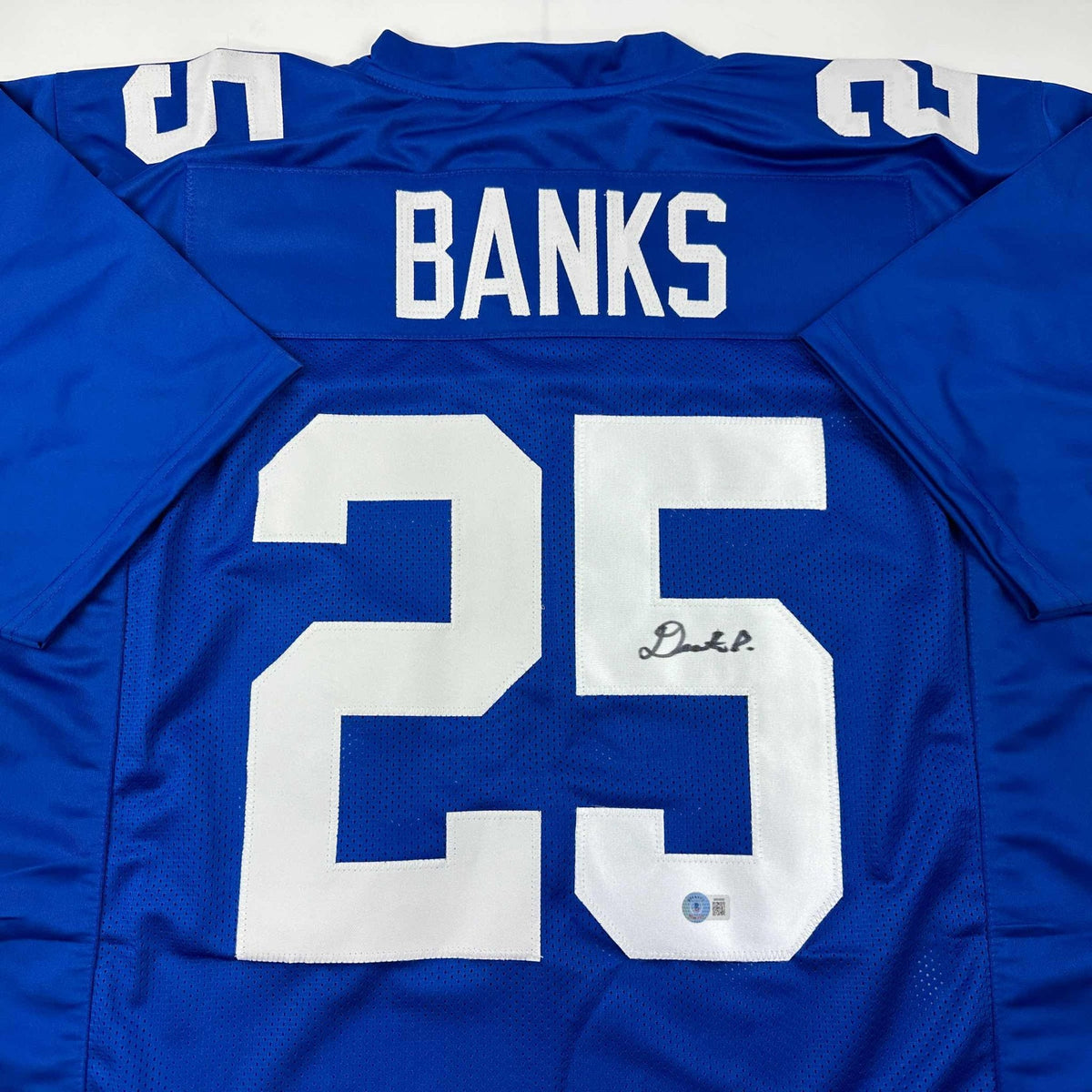 Autographed/Signed Deonte Banks New York Blue Football Jersey Beckett BAS COA