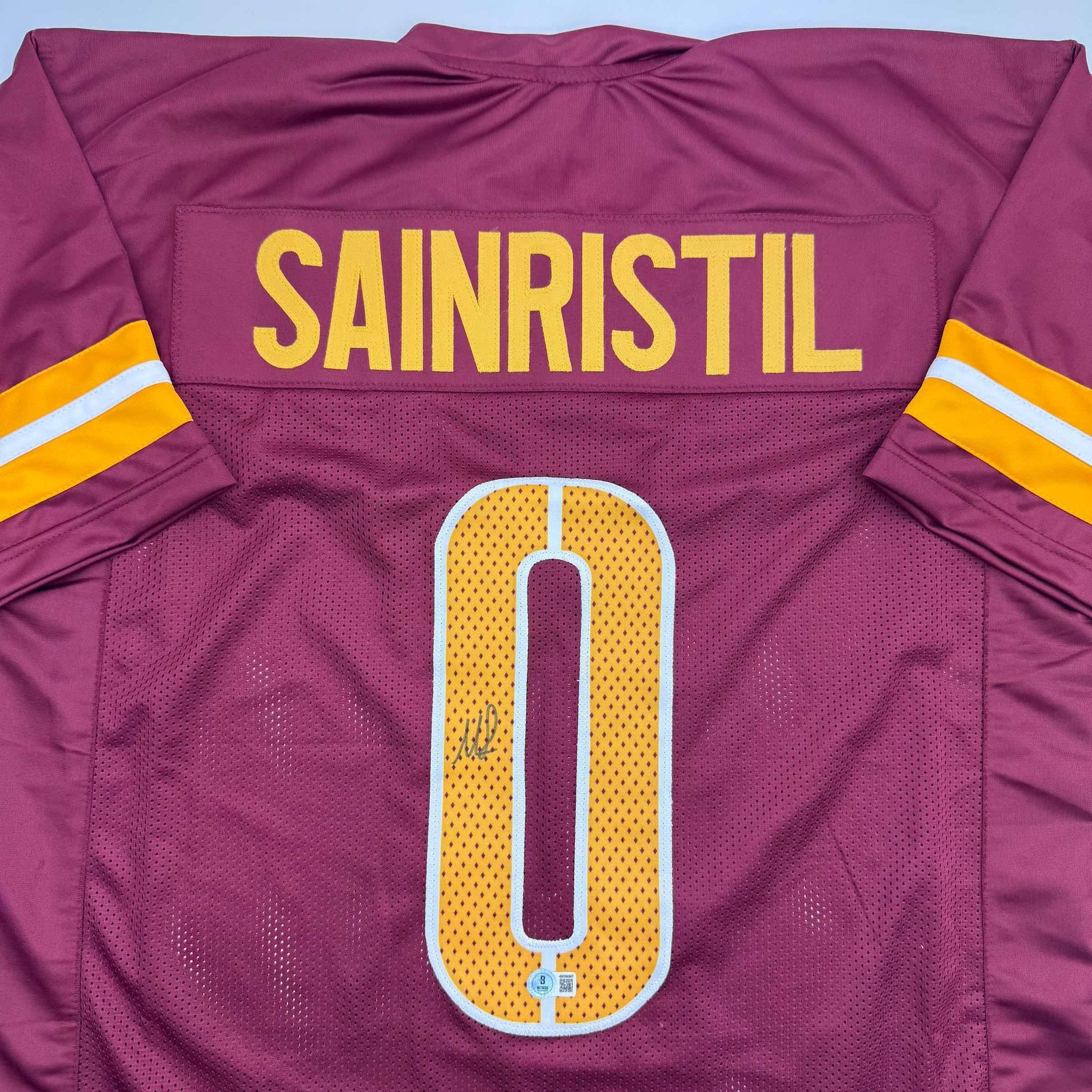 Autographed/Signed Mike Sainristil Washington Burgundy Football Jersey Beckett BAS COA