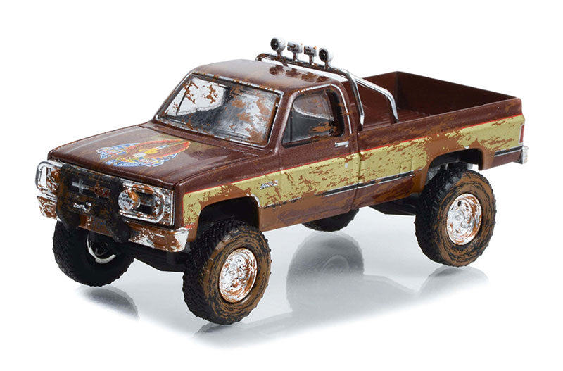 Greenlight 44965-F 1/64 Scale 1982 GMC K-2500 Sierra Grande Wideside Pickup Dirty