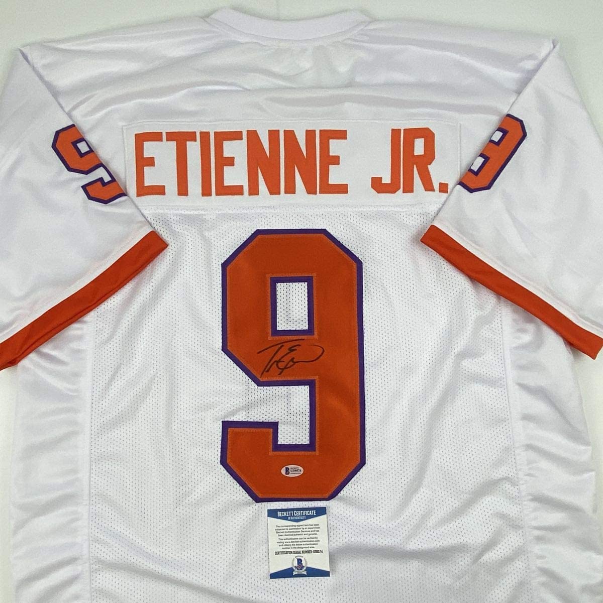 Autographed/Signed Travis Etienne Jr. Clemson White College Football Jersey Beckett BAS COA