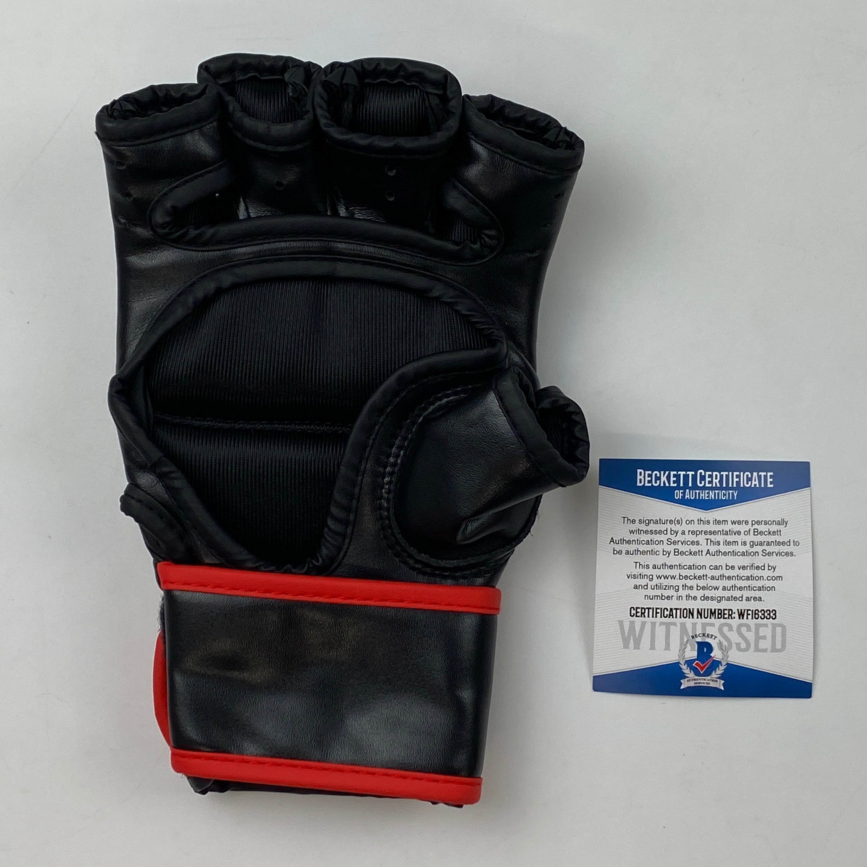 Autographed/Signed Jon Bones Jones Black UFC MMA Glove Ultimate Fighting Beckett BAS COA