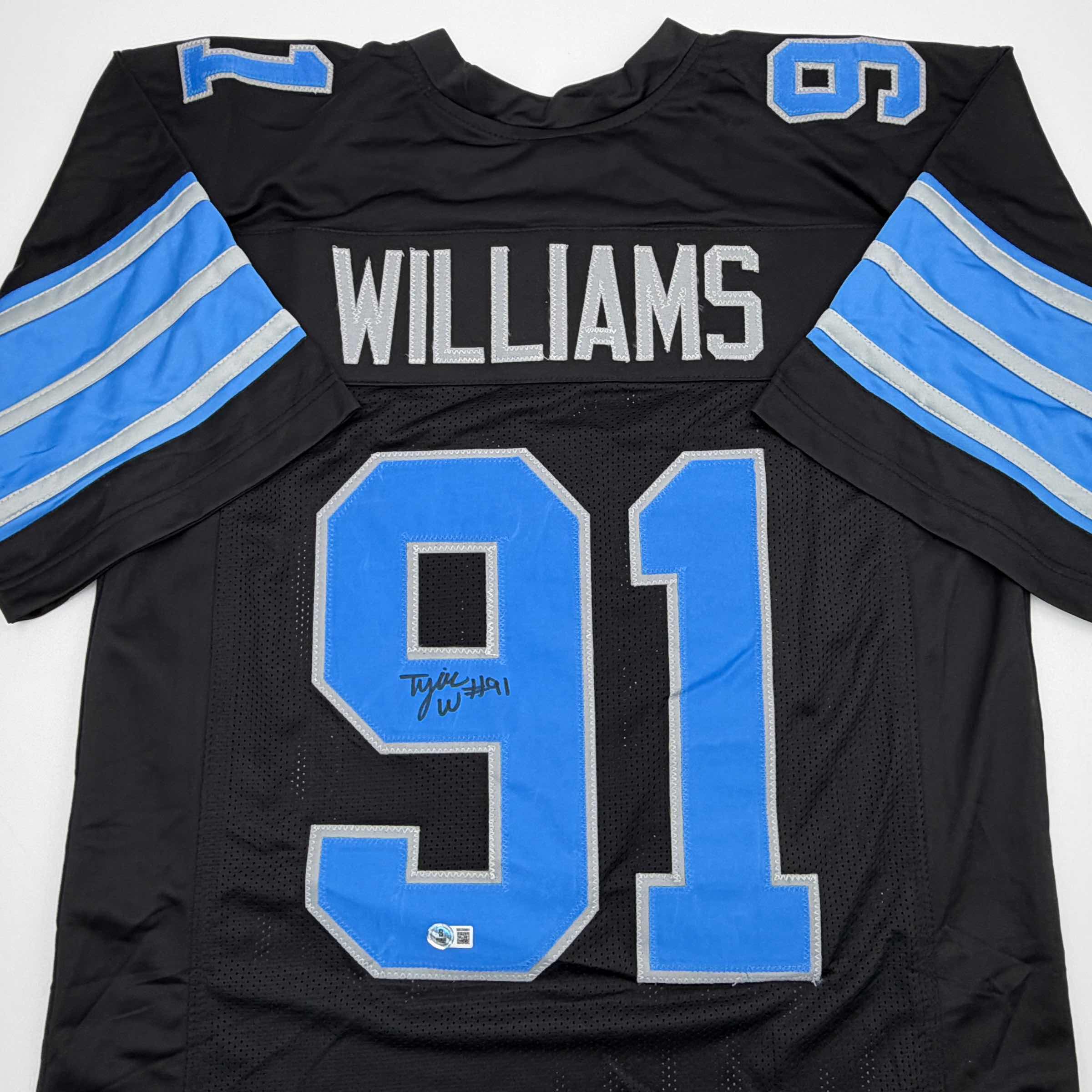Autographed/Signed Tyleik Williams Detroit Black Football Jersey Beckett BAS COA