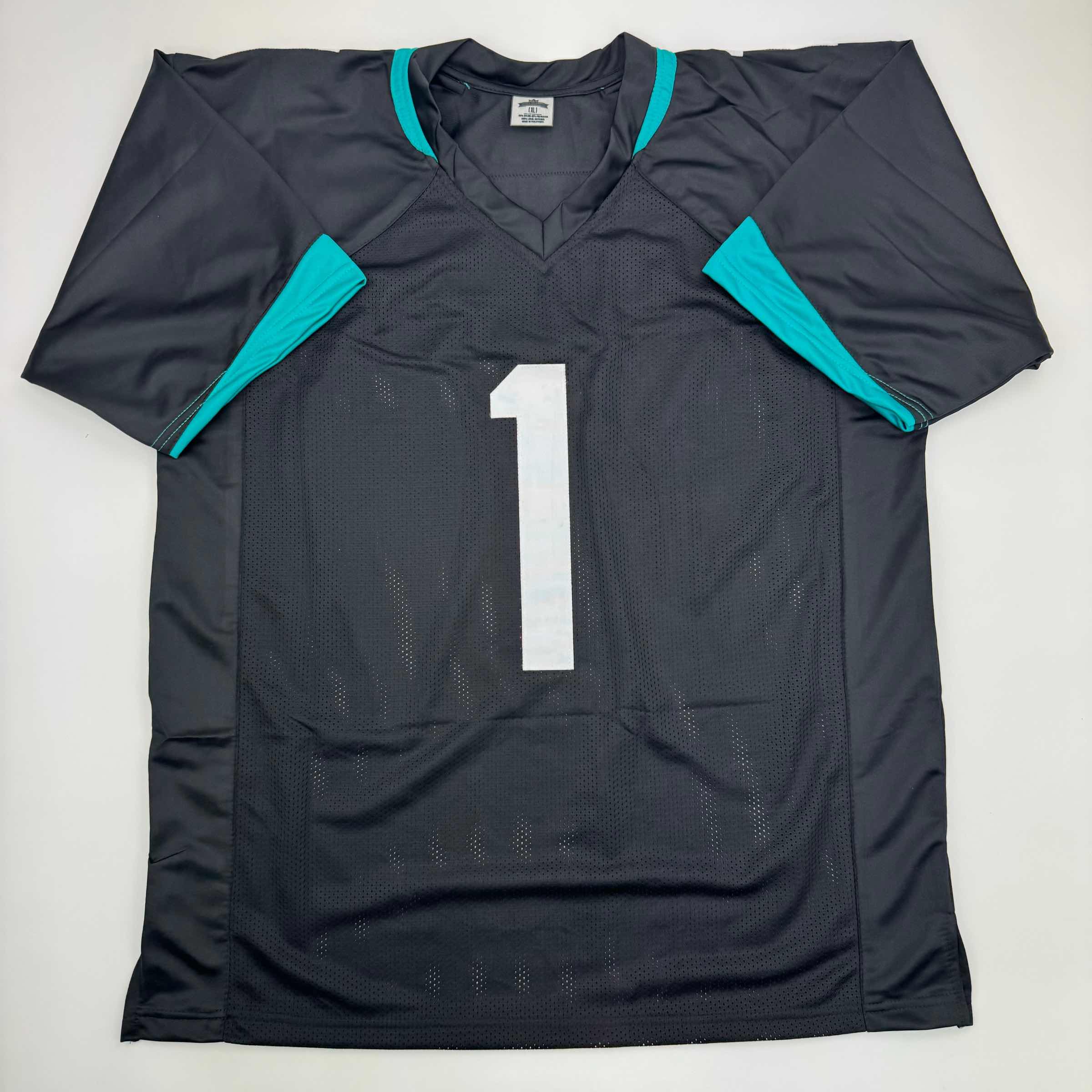 Autographed/Signed Travis Etienne Jr. Jacksonville Black Football Jersey Beckett BAS COA