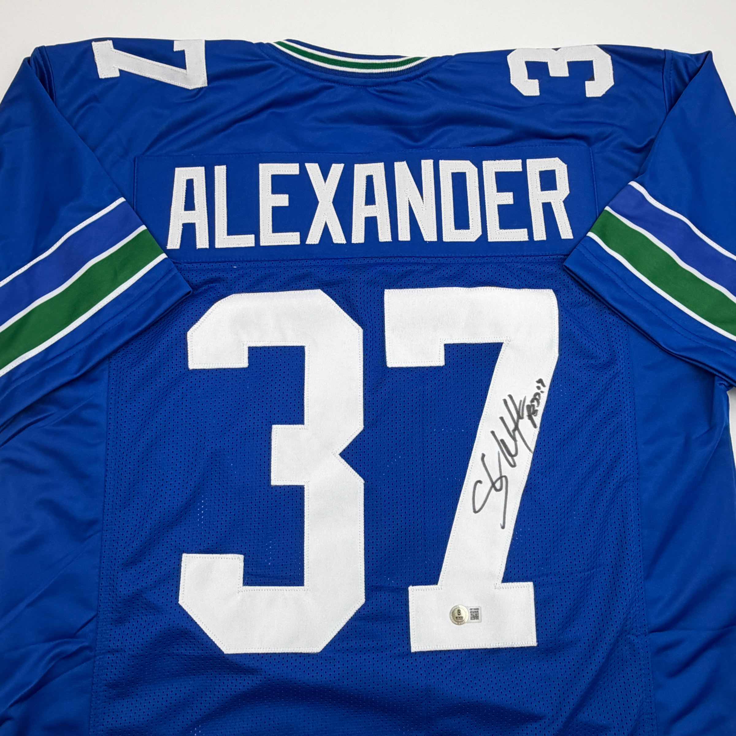 Autographed/Signed Shaun Alexander Seattle Blue Football Jersey Beckett BAS COA