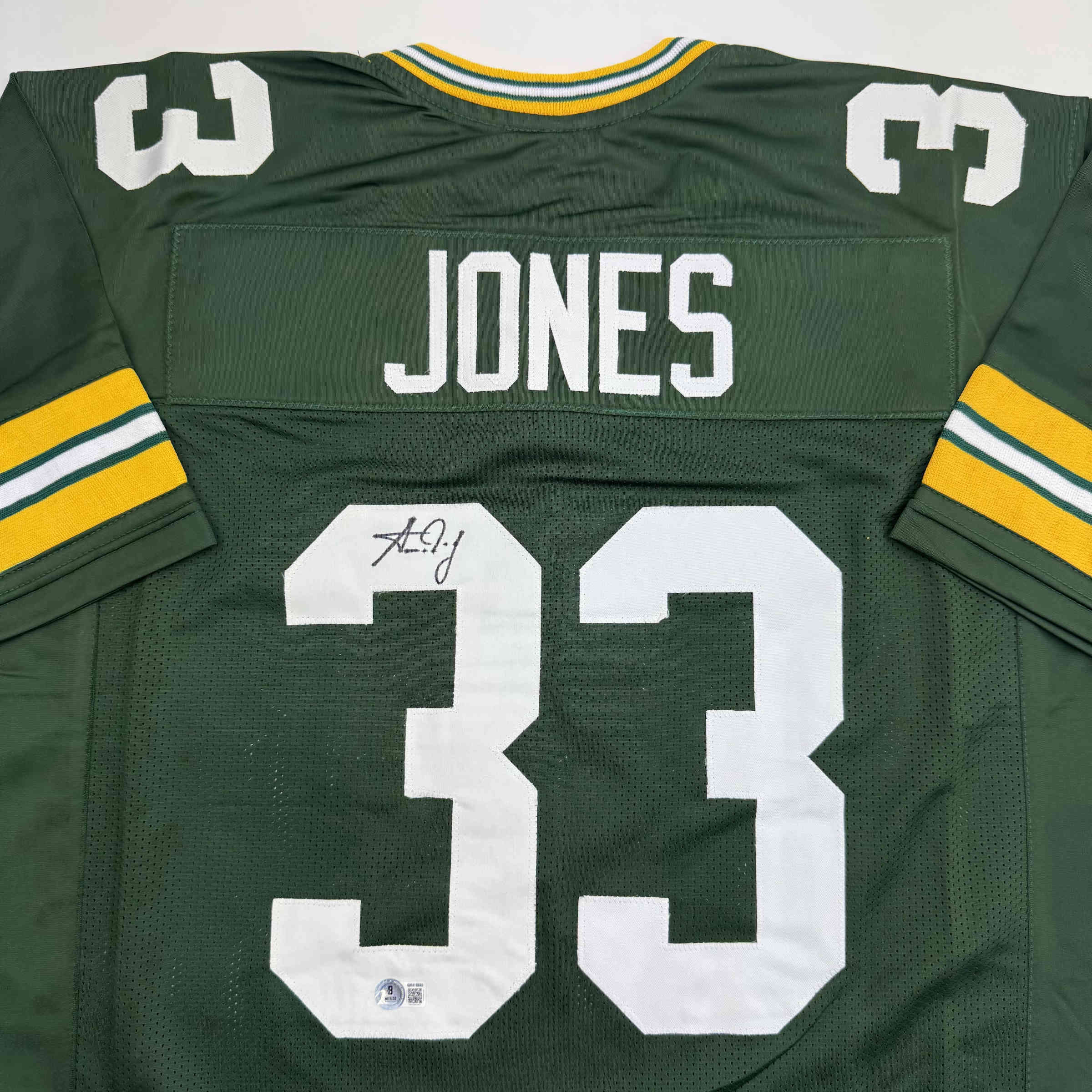 Autographed/Signed Aaron Jones Green Bay Green Football Jersey Beckett BAS COA